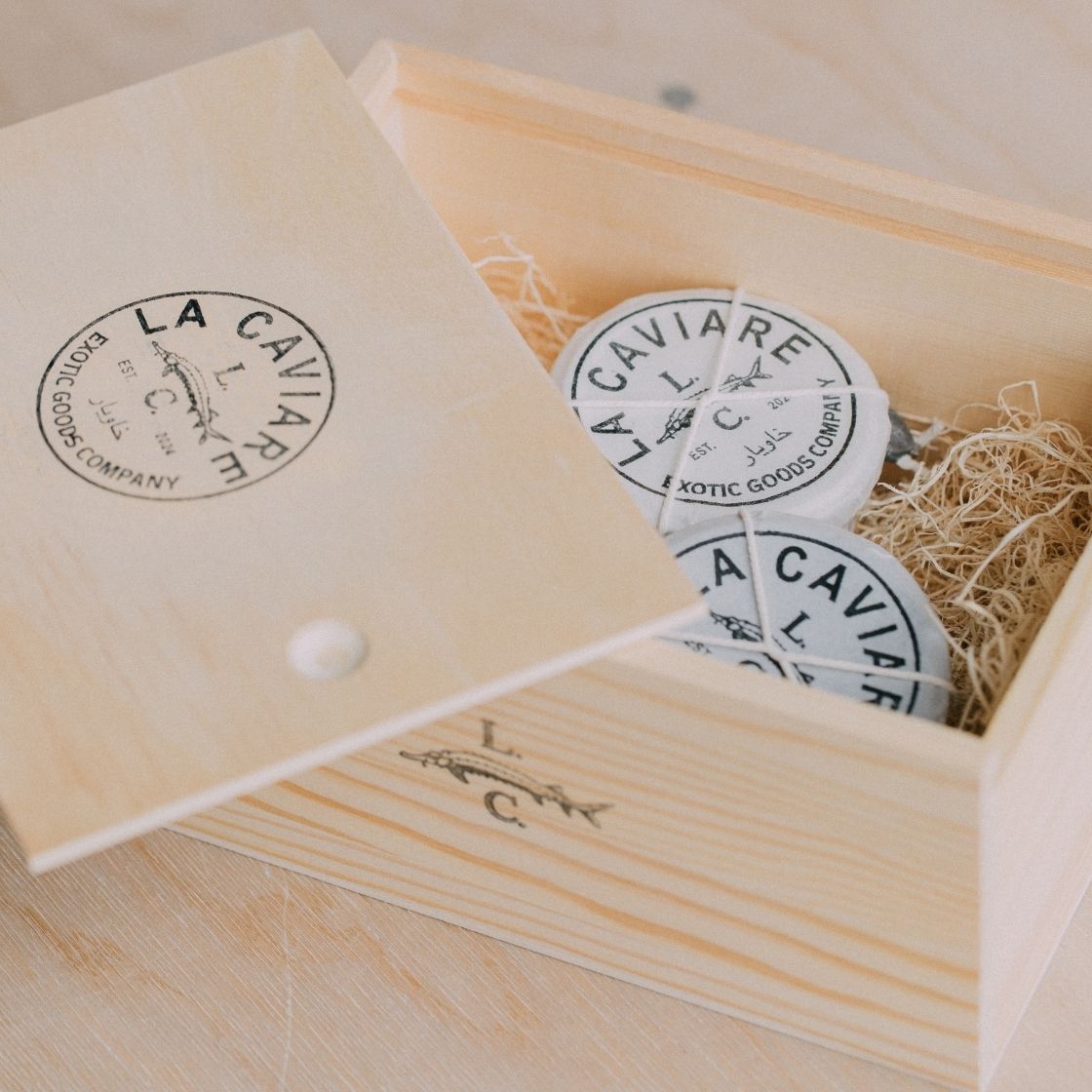 Wooden box with 'La Caviare' branding and corporate caviar gifting
